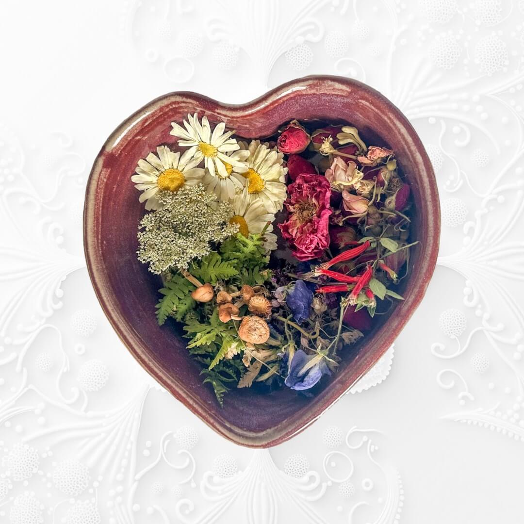A heart dish filled with dried flowers