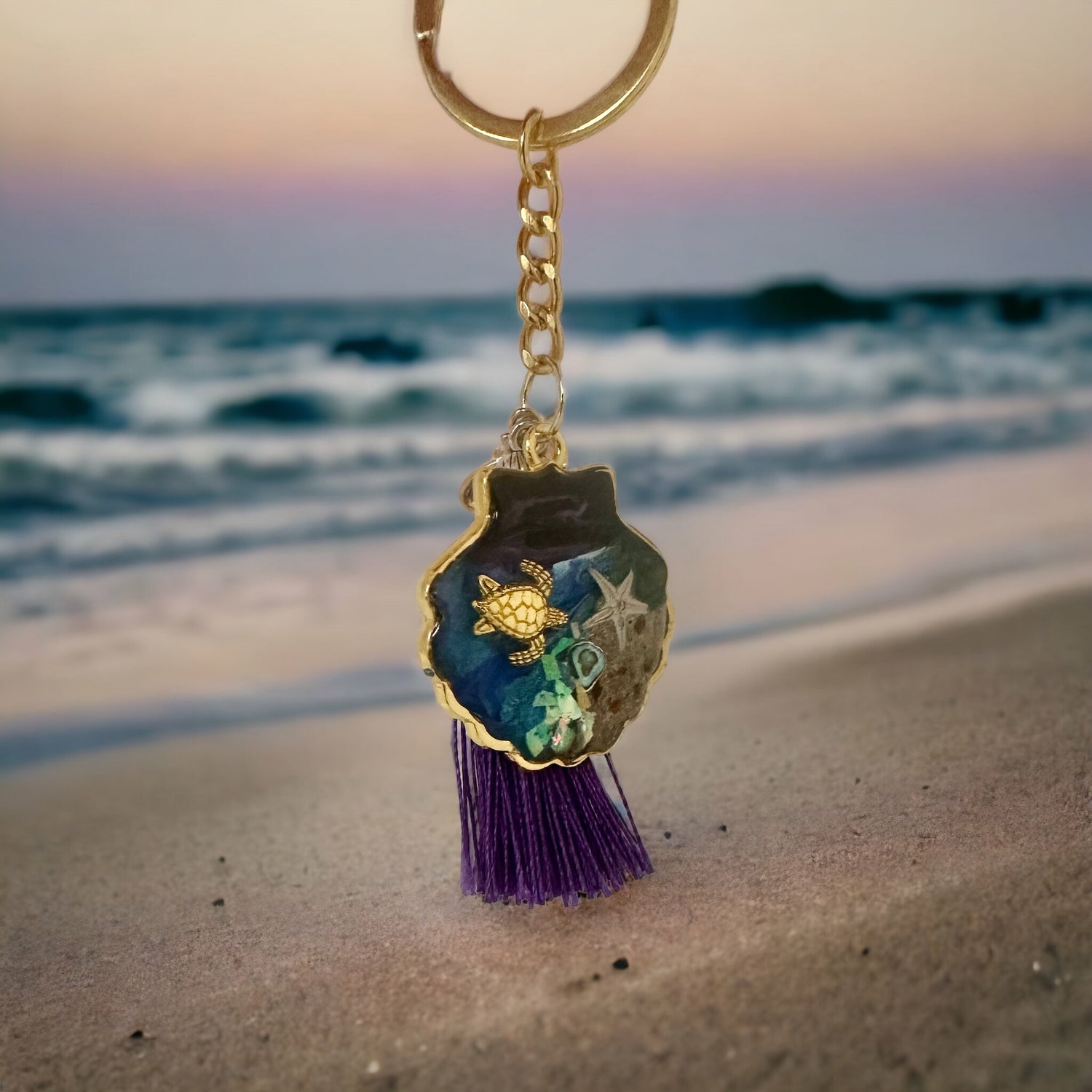 An ocean themed keychain created with resin and real seashells
