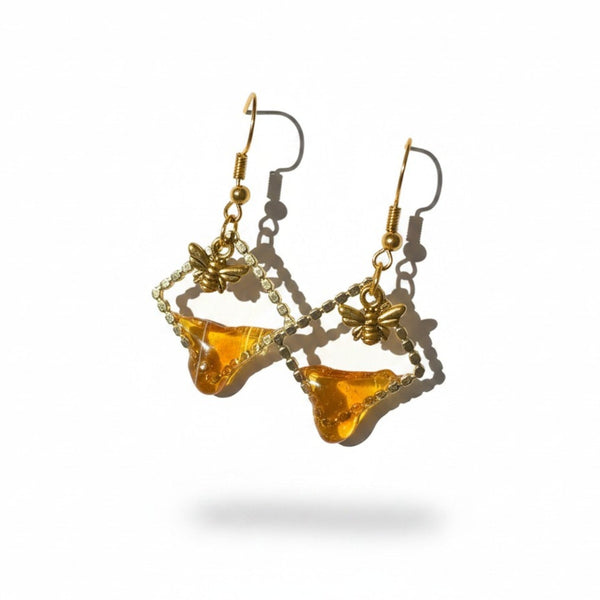 Handmade honey bee drip earrings with gold bee charm & hypoallergenic hooks. One of a kind, made in Cold Lake, Alberta.