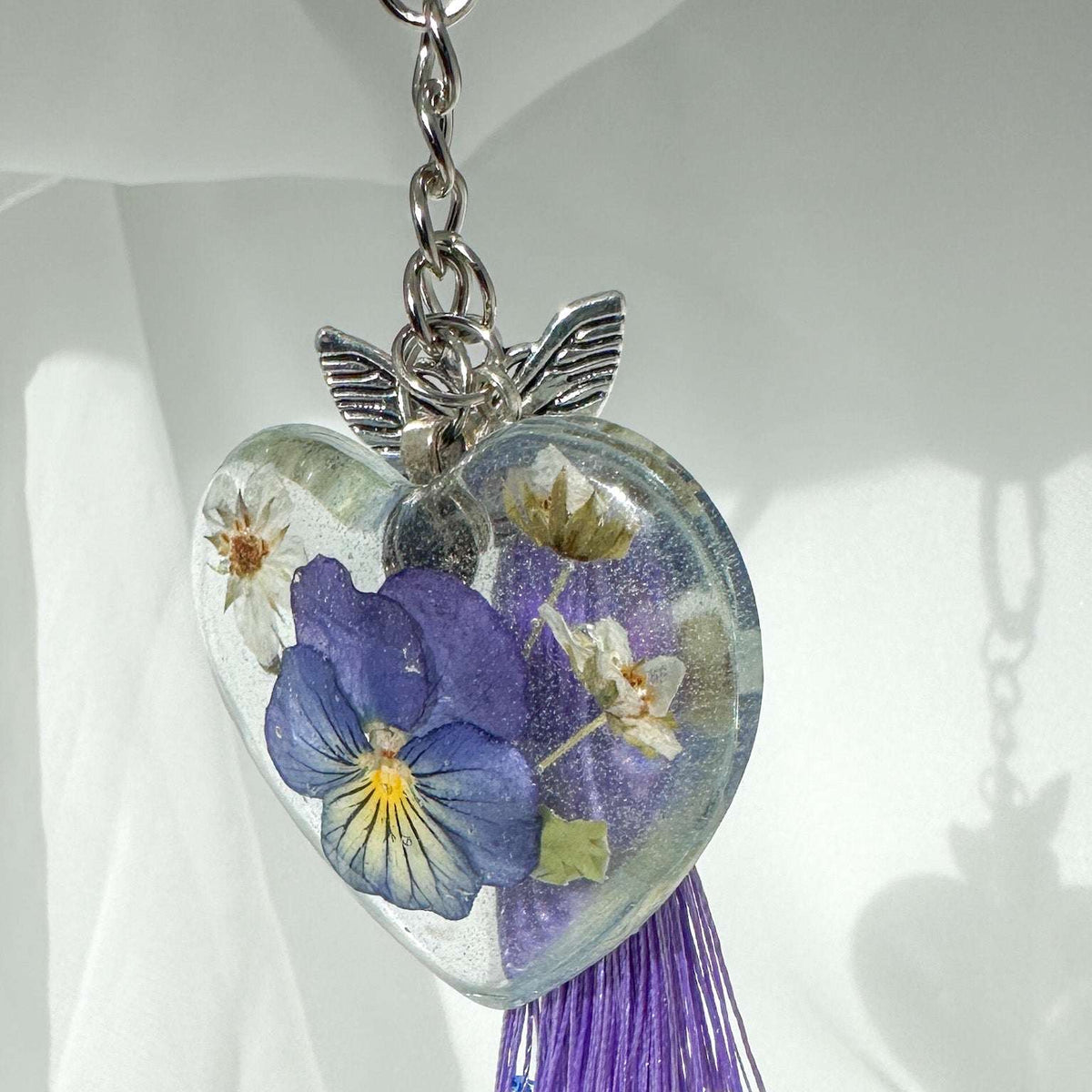 Keychain Fluttering Heart: Pansy Resin Keychain with Butterfly Charm