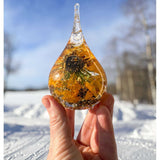 A close-up detail shot of the vibrant Black-Eyed Susan and sunflower suspended inside the clear resin ring holder