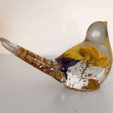 Handcrafted yellow floral resin bird with a real yellow daisy and gold leaf
