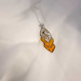 Capture nature's beauty with this exquisite honey bee themed pendant, crafted with real pressed flowers encased in honey-tinted resin. Handmade and one of a kind