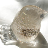 Wish Keeper Songbird dandelion resin bird on a sunny surface catching natural light