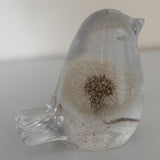 Wish Keeper Songbird dandelion resin bird on a sunny surface catching natural light