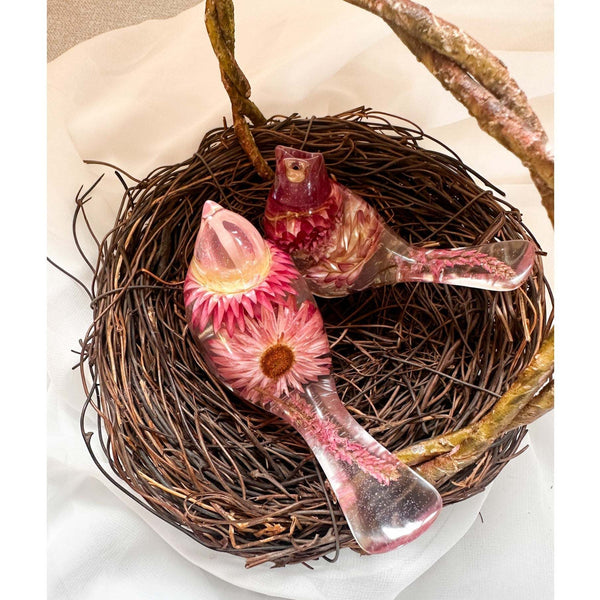 Rosy Nest Duo pink strawflower resin bird pair nestled together in a natural twig nest