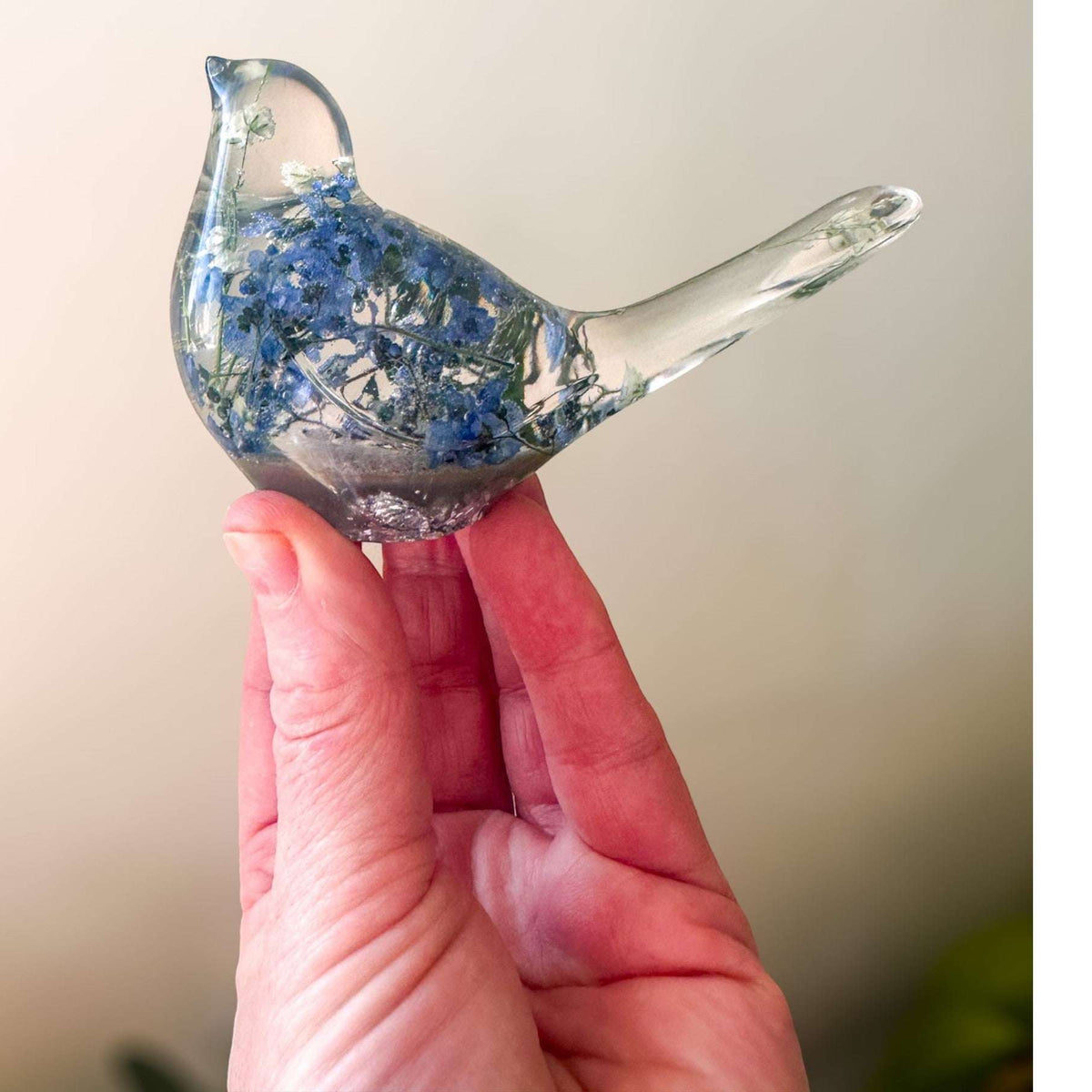 Handmade Forever Songbird memorial resin bird with preserved forget-me-nots and customizable gold, silver, or glitter base