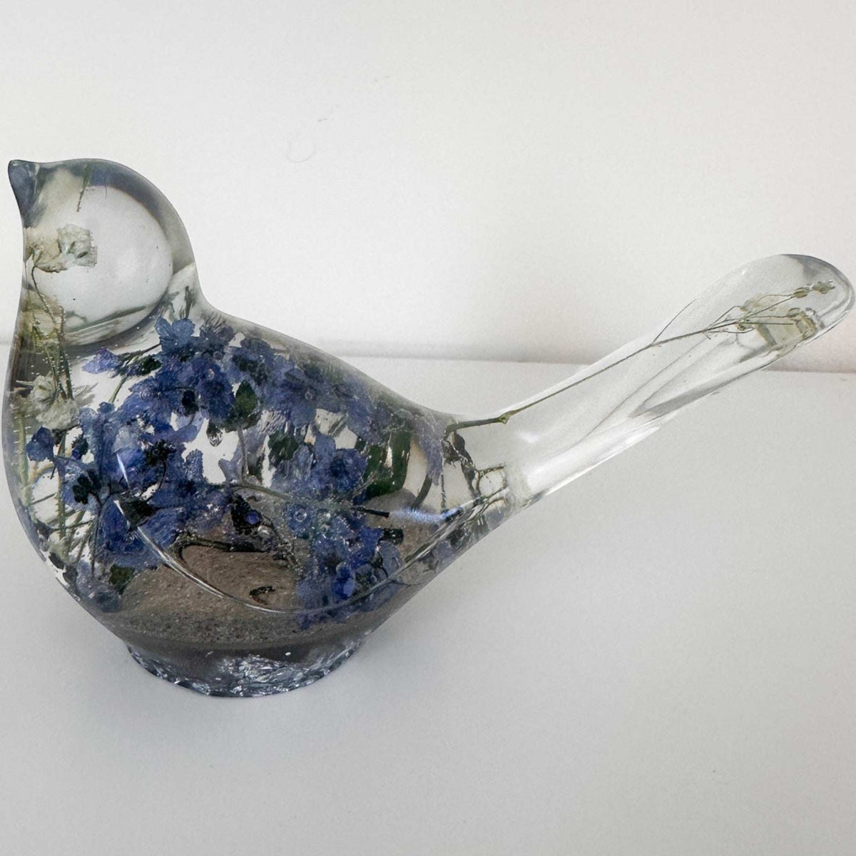Handmade Forever Songbird memorial resin bird with preserved forget-me-nots and customizable base finishes