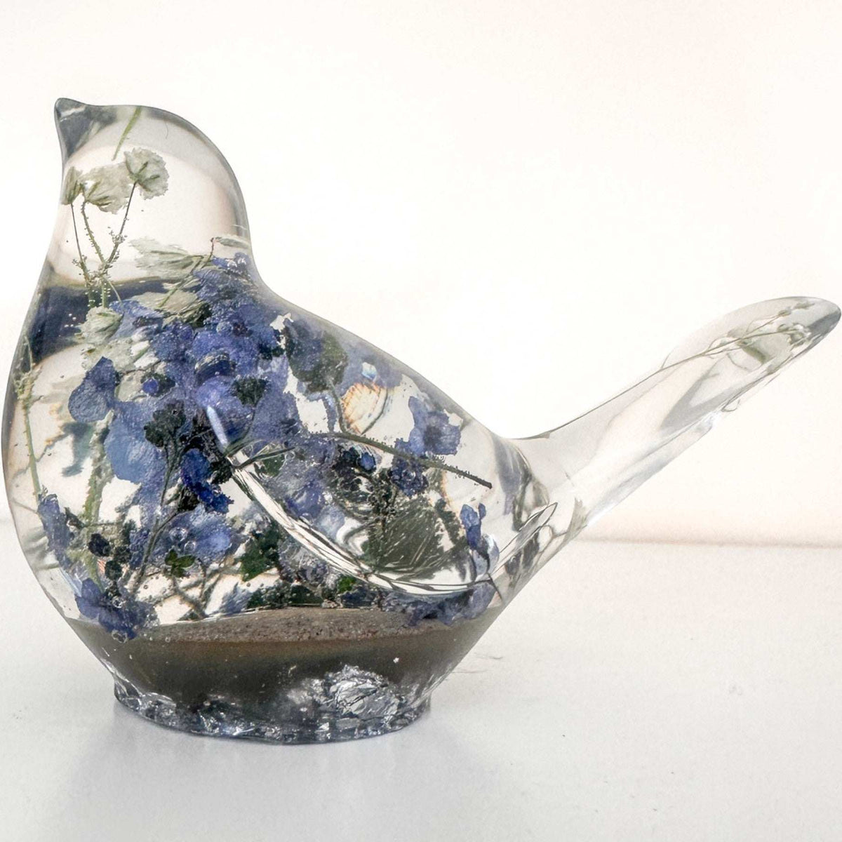 Handmade Forever Songbird memorial resin bird with preserved forget-me-nots and customizable base finish