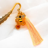 Amber Feather Bookmark honey bee bookmark handmade with gold feather hook, amber honeycomb and orange tassel
