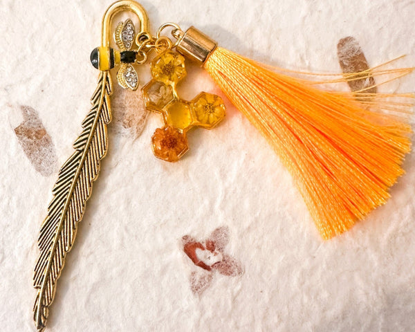 Amber Feather Bookmark honey bee bookmark handmade with gold feather hook, amber honeycomb and orange tassel
