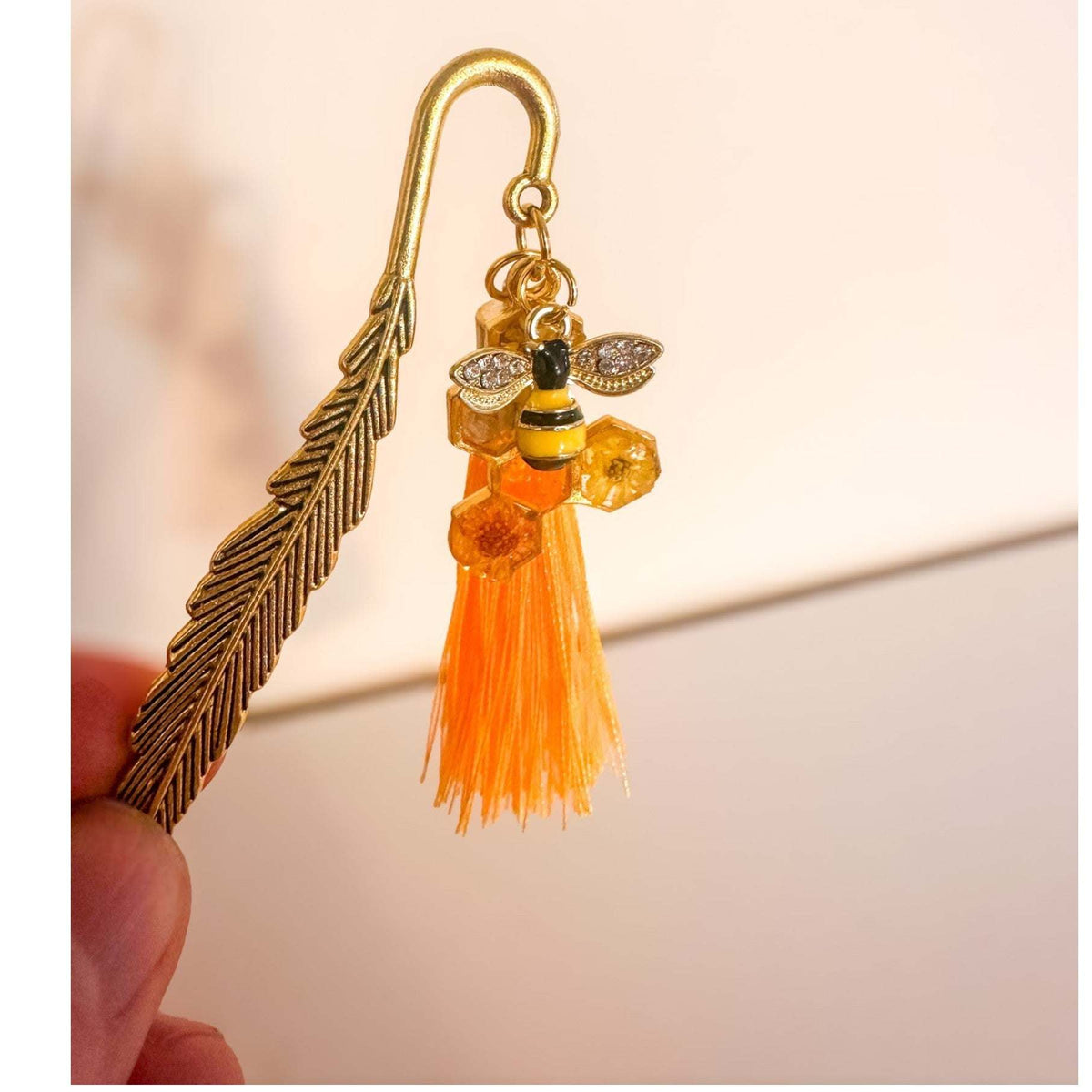 Amber Feather Bookmark honey bee bookmark handmade with gold feather hook, amber honeycomb and orange tassel
