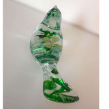 Clear resin bird figurine filled with real green four leaf clovers, vibrant green botanicals, and gold flakes,