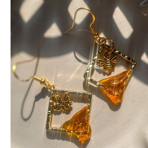 Handmade honey bee drip earrings with gold bee charm & hypoallergenic hooks. One of a kind, made in Cold Lake, Alberta.
