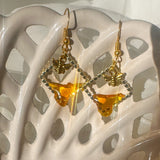 Handmade honey bee drip earrings with gold bee charm & hypoallergenic hooks. One of a kind, made in Cold Lake, Alberta.