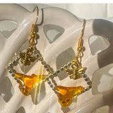 Handmade honey bee drip earrings with gold bee charm & hypoallergenic hooks. One of a kind, made in Cold Lake, Alberta.