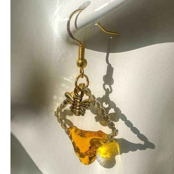 Handmade honey bee drip earrings with gold bee charm & hypoallergenic hooks. One of a kind, made in Cold Lake, Alberta.