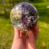 Purple lilac resin sphere with real lilac and hydrangea flowers on LED light base