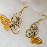 Fluttering Blossom earrings with real pressed flowers in resin butterfly wings and dainty butterfly accents