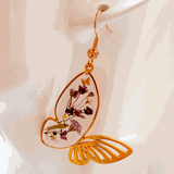 Fluttering Blossom handmade earrings with real pressed flowers encased in resin butterfly wings and dainty butterfly accents