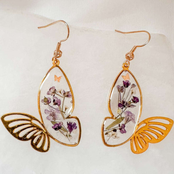 Handmade Fluttering Blossom Earrings with real pressed flowers in resin butterfly wings and lightweight hypoallergenic hooks