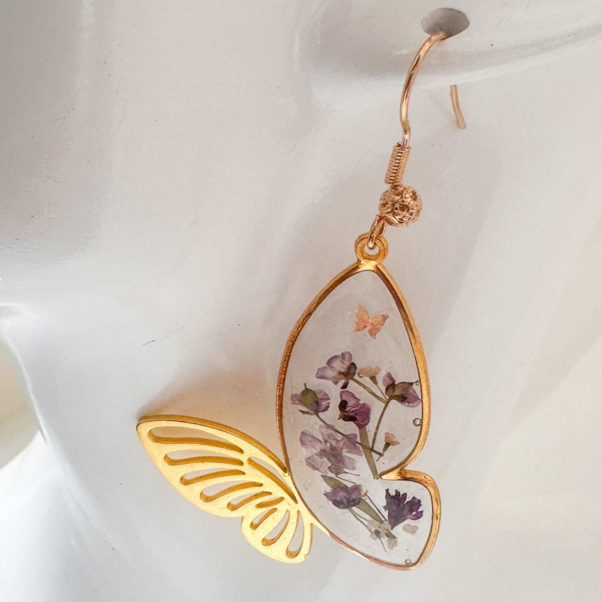 Fluttering Blossom handmade earrings with real pressed flowers in resin butterfly wings and dainty butterfly accents