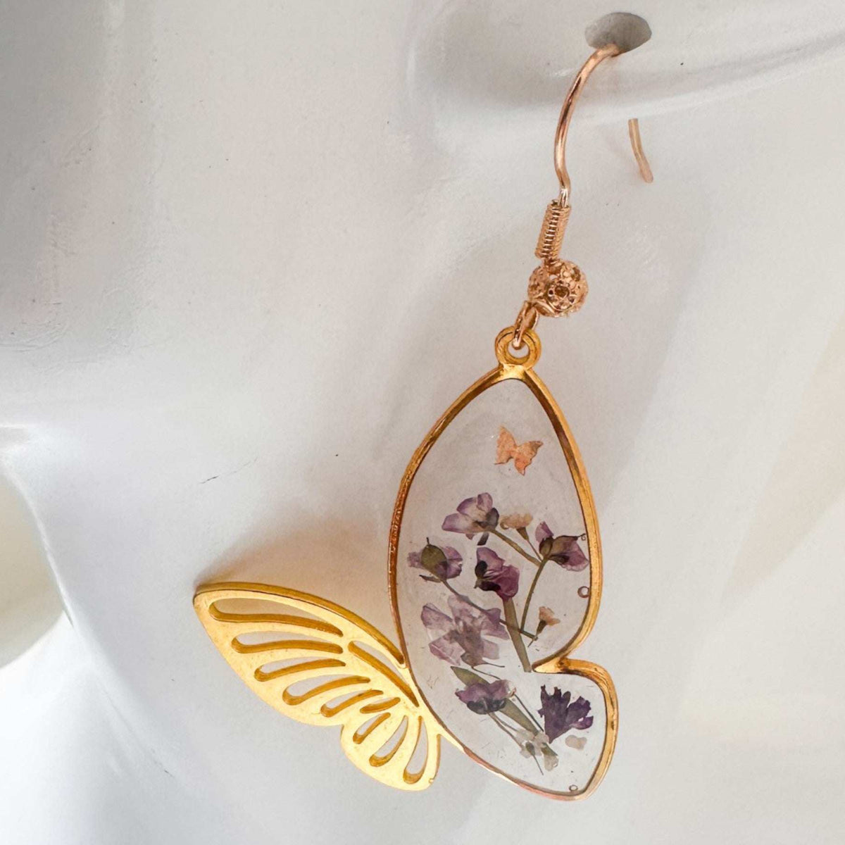 Fluttering Blossom earrings with real pressed flowers in resin butterfly wings and delicate butterfly accents