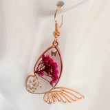 Garden Wing Earrings with pressed pink and white flowers in rose gold butterfly frame and gold accent butterfly