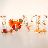 Pressed flower resin LOVE word art with real wildflowers and ladybug accent