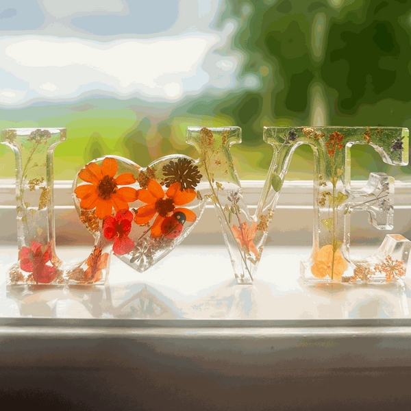 Wildflower LOVE word art with real pressed flowers and ladybug in clear resin letters for home decor
