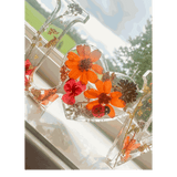 Pressed flower resin decor LOVE word art with real orange and red blooms and ladybug accent