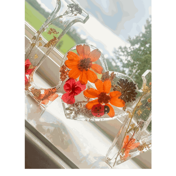 Pressed flower resin decor LOVE word art with real orange and red blooms and ladybug accent