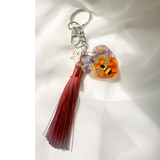 Honeybee Heart Bag Charm with rhinestone bee, pressed purple flowers, golden honeycomb in resin heart and copper tassel keychain