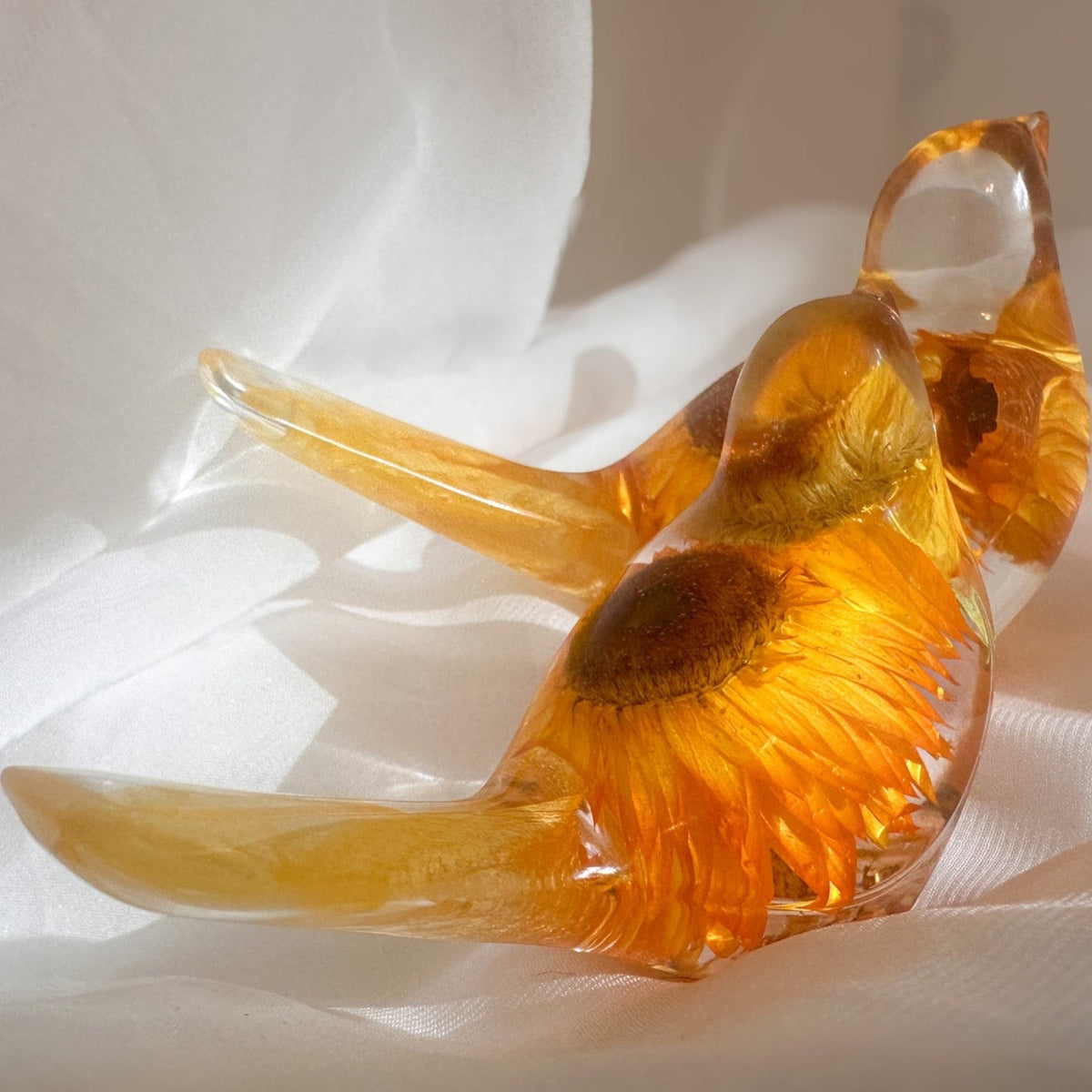Strawflower resin bird pair with preserved golden yellow strawflowers inside clear resin figurines
