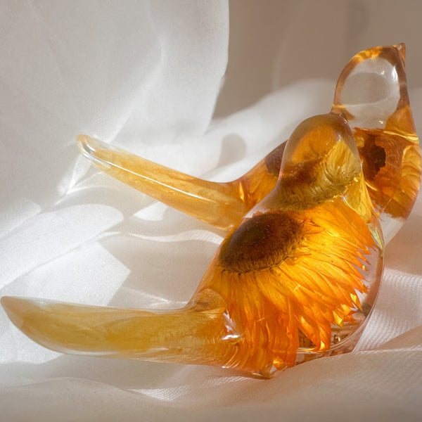 Strawflower resin bird pair with preserved golden yellow strawflowers inside clear resin figurines