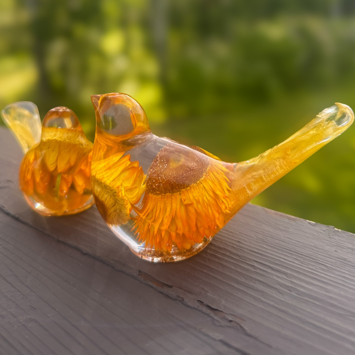 Golden strawflower resin bird pair with preserved yellow blooms and gold leaf shimmer