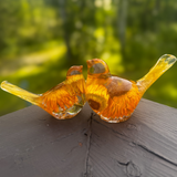 Golden strawflower resin bird pair with preserved yellow blooms and gold leaf shimmer