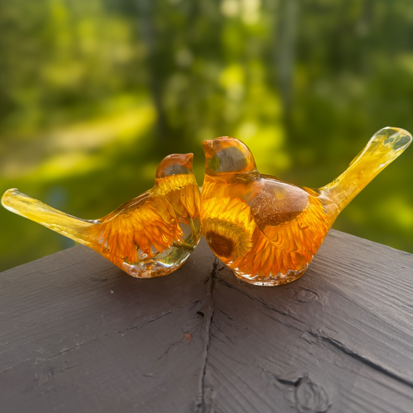 Golden strawflower resin bird pair with preserved yellow blooms and gold leaf shimmer