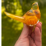 Golden strawflower resin bird pair with preserved yellow blooms and gold leaf shimmer