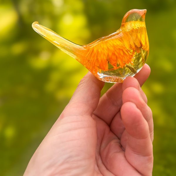 Strawflower resin bird pair with preserved yellow and amber blooms in clear resin forms