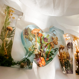 Boreal Mushroom LOVE word art with real hand-foraged mushrooms, ferns, moss, and gold leaf accents in clear resin letters
