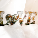 Boreal Mushroom LOVE word art with real mushrooms, ferns, moss, and gold leaf in clear resin decor