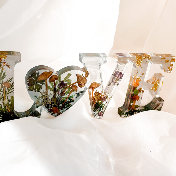 Boreal Mushroom LOVE word art with real mushrooms, ferns, moss, and gold leaf in clear resin decor
