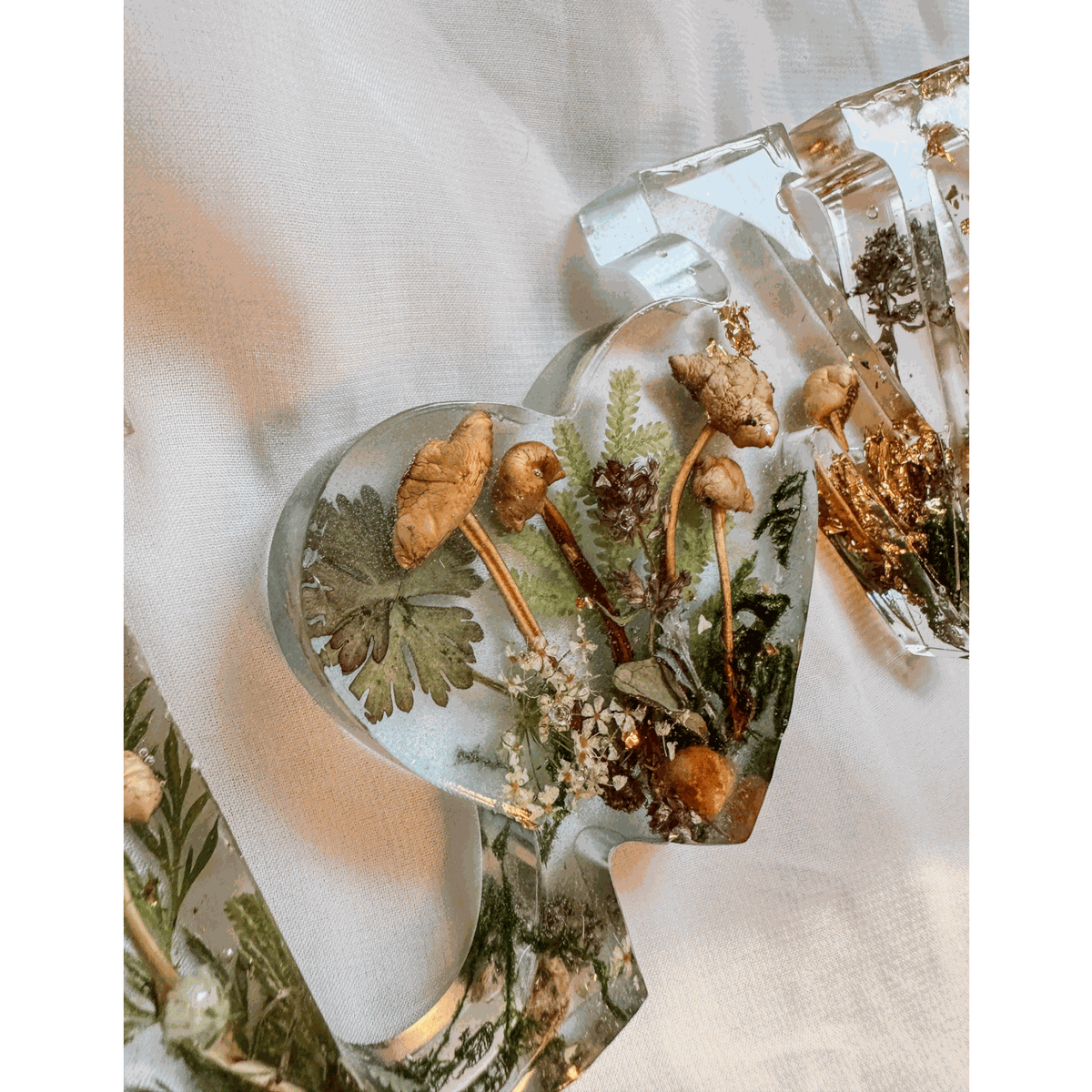 Boreal Mushroom LOVE word art with hand-foraged mushrooms, ferns, moss, and gold leaf in clear resin letters