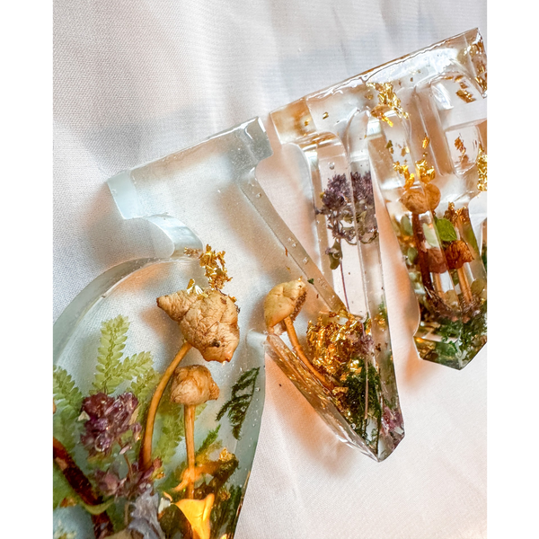 Boreal Mushroom LOVE word art with real hand-foraged mushrooms, ferns, moss, and gold leaf in clear resin letters