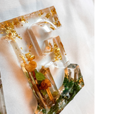 Boreal Mushroom LOVE resin word art with real mushrooms, ferns, moss, and gold leaf accents
