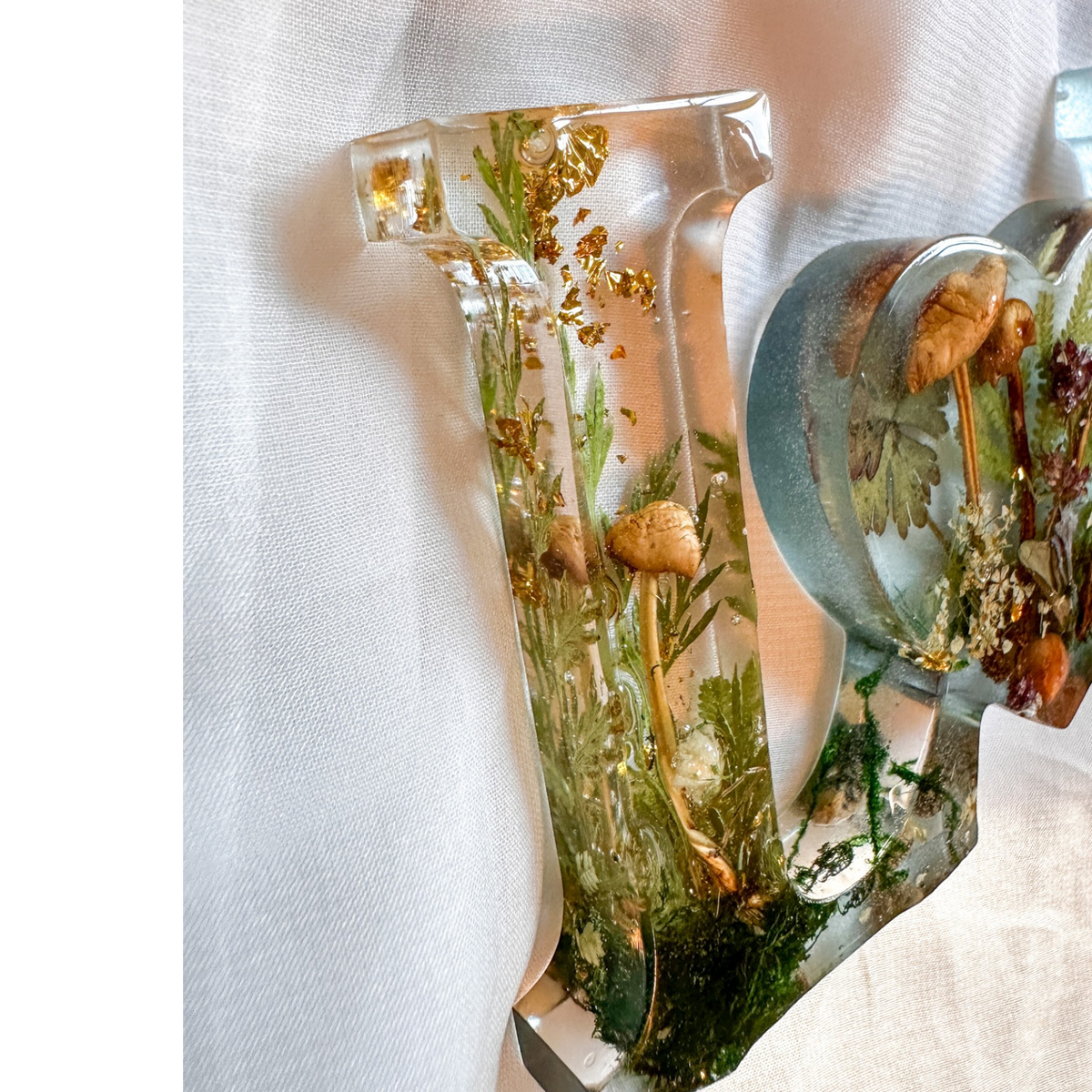 Boreal Mushroom LOVE word art with real hand-foraged mushrooms, ferns, moss, and gold leaf in clear resin letters