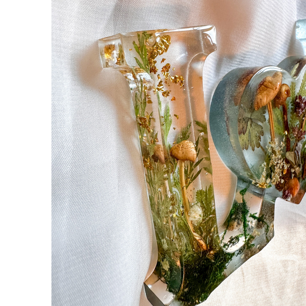 Boreal Mushroom LOVE word art with real hand-foraged mushrooms, ferns, moss, and gold leaf in clear resin letters