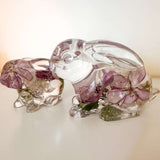 Two handmade apple blossom bunnies in clear resin with preserved flowers, displayed as a matching decorative pair