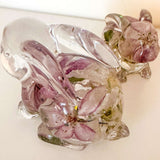 Two handmade apple blossom bunnies in clear resin with real preserved flowers sitting together